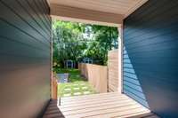 Step outside through the backdoor onto a covered back deck overlooking the large fenced in yard!