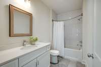 The upper level secondary bedroom (bedroom #2) has an ensuite bath with a lovely soaking tub, timeless subway tile surround and a generously sized vanity!
