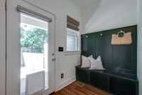 Cute and functional drop zone by the backdoor. There is also a large coat closet. This house really has great storage and closet space!