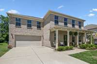 wide driveway with room for four vehicles plus tandem depth garage for vehicles, toys, workshop!