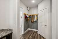 nice space between main floor hallway and garage for coats and storage