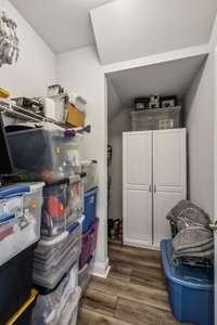 front hall closet with GREAT storage capacity around the corner