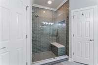 Look at that shower! In between two walk in closets