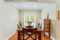 Large dining room with sunlight flooding in