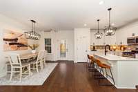 At the heart of the home is the kitchen, a culinary space that will delight any home chef. Under-cabinet lighting not only adds a decorative element but also improves task lighting.