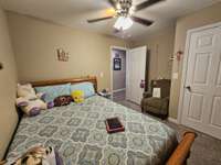Bedroom number one with ceiling fan.