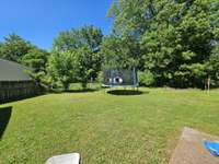 Nice trees surrounding back yard.