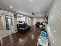 Large great room stretches from front to rear of home.