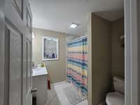Primary bathroom features a combo tub/shower.