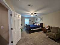 Large primary bedroom easily accommodates a king size bed.