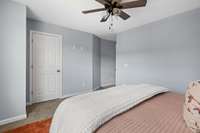 It has a large walk-in closet, complete with shelving.