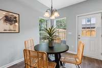There's plenty of space for a formal dining table. (Note this is not an end unit so it does not have a second corner window)