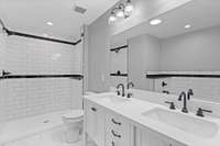The primary bath is stunning! An extra wide mirror frames the double vanities.