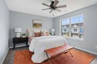 Upstairs is a beautiful primary bedroom that's full of natural light!