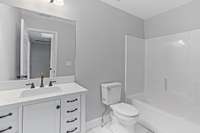 Another full bath is easily accessible to both of these bedrooms.