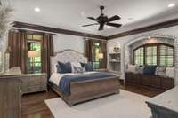 Primary suite on the main floor. Elegant mill work and exposed brick arched window set the tone.