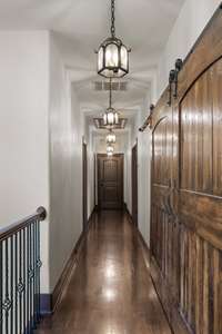 Upstairs gallery hallway from the grand stairway. The doors to the right open to the study...