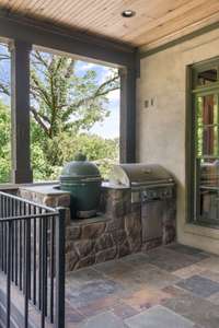Grilling station on main floor porch. The Green Egg can convey.