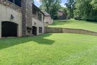 Pool excavation has been completed and back-filled. Pool and hardscape plans are available. The shaded entries open to the ground level patio with 13' ceiling, sound, fans, and two-sided fireplace.