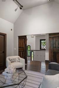 Alternate view from the study overlooking the grand stairway. The door to the left is a walk-in closet with built-ins. Fiber internet connection and whole-house LAN wired.