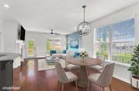 Virtually staged open floodplain dining area, living room with fireplace. Wood floors throughout lower level!