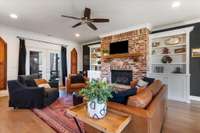 Beautiful custom built ins help accentuate the fireplace.