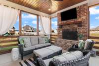 Screened in outdoor patio and wood burning fireplace with gas starter - perfect for enjoying evening sunsets.