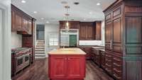 This kitchen is a chef's dream!! It has three Wolf ovens, double Wolf cooktop range, griddle, steamer, Miele coffee machine, SubZero fridge, two cooling drawers, two dishwashers and amazing storage.