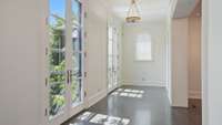 Front hallway looks out front through the French doors