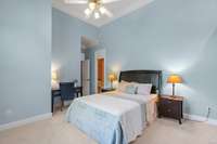 Secondary bedroom on main floor with soaring ceilings