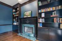 Study built in bookcases and fireplace with current paint color