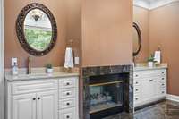Primary en suite bath with double sided fireplace