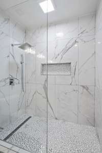 Walk in shower with frameless glass door