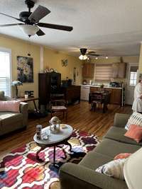 VIEW FROM THE THIRD BEDROOM TO THE DINING ROOM AND KITCHEN.