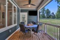 406 sq ft screened in porch with a private door to the primary suite