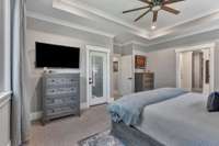 Primary suite with door to the 406 sq ft screened in porch