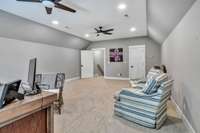 Upstairs bonus room above the garage with floored attic storage
