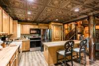 Metal tile ceiling and farmhouse sink
