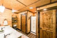 Main bath with his and her closets