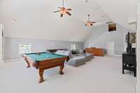 Massive bonus room with built in's, wet bar, fireplace, and storage - second level.