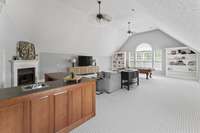 Massive bonus room with built in's, wet bar, fireplace, and storage - second level.