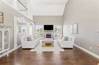 Spacious living room with tall ceilings. Large space for entertaining and family gatherings.