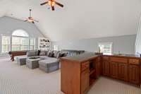 Massive bonus room with built in's, wet bar, fireplace, and storage - second level.