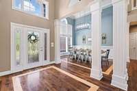Beautiful entry foyer with lots of natural light. Opens into the living room and dining room.