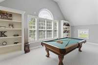 Massive bonus room with built in's, wet bar, fireplace, and storage - second level.
