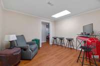 Basement apartment flex room. Through the door is another flex room currently being used as a fitness room. Also has storage & a cedar lined room with a combo lock (at one point was used as a gun safe).