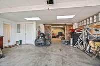 Separate 2-car garage for basement apartment. Workshop area in the back past the barn doors.
