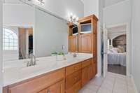 Master bath with 16-ft ceilings, large walk-in shower with two shower heads, body sprayers and large bench, jacuzzi tub, water closet, and heated tile floors