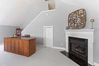 Massive bonus room with built in's, wet bar, fireplace, and storage - second level.