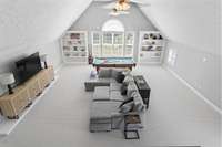 Massive bonus room with built in's, wet bar, fireplace, and storage - second level.